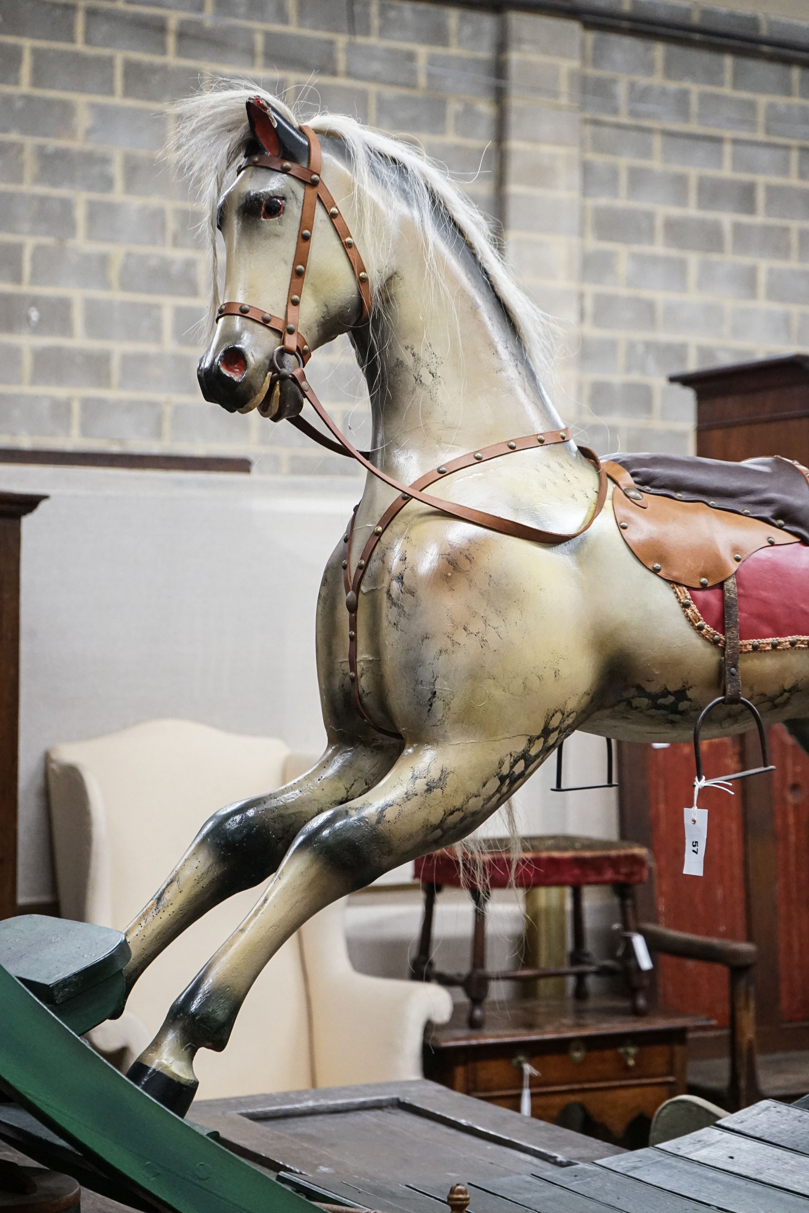 A large Victorian style painted rocking horse with end seats, length 240cm, height 132cm